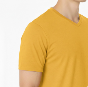 A male model wearing a premium lightweight cotton jersey v-neck t-shirt with a minimalist black logo on the left chest, featuring a modern fit and clean design.