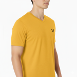 A male model wearing a premium lightweight cotton jersey v-neck t-shirt with a minimalist black logo on the left chest, featuring a modern fit and clean design.