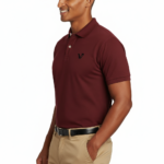 A premium men's short-sleeve pique polo shirt featuring a two-button closure, a minimalist chest logo, and a traditional straight-cut hem with side slits.