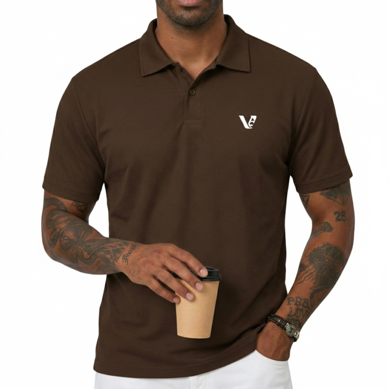 Man wearing a dark brown polo t-shirt with a small white V logo on the left chest holding a coffee cup.
