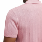 A men's short-sleeve performance polo shirt featuring a textured pique knit, a three-button placket, and a classic straight-cut bottom hem.