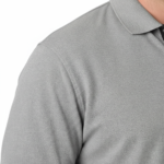 A high-quality men's performance polo shirt with a three-button placket, a minimalist chest logo, and a traditional straight-cut bottom hem.