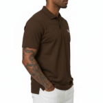 Man wearing a dark brown polo t-shirt with a small white V logo on the left chest holding a coffee cup.