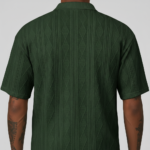 A high-stretch men's muscle-fit v-neck t-shirt featuring a vertical ribbed knit texture and a modern curved longline bottom hem.