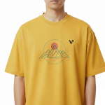 oversized t-shirt featuring a geometric mountain peak and sun graphic on the chest with a small black VALE logo.