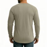 A high-performance men's muscle slim-fit t-shirt featuring a minimalist chest logo and a modern curved longline hem for an elongated silhouette.