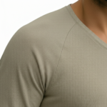 A high-performance men's muscle slim-fit t-shirt featuring a minimalist chest logo and a modern curved longline hem for an elongated silhouette.