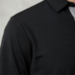 A high-performance moisture-wicking pique golf polo with a three-button placket, minimalist chest logo, and a traditional straight-cut bottom hem.