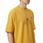 oversized t-shirt featuring a geometric mountain peak and sun graphic on the chest with a small black VALE logo.