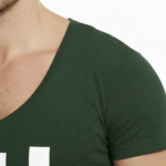 Man wearing VALE brand deep v-neck slim fit t-shirt with bold white vertical logo
