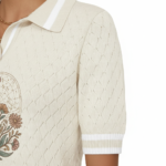 Women's VALE botanical graphic knit polo shirt in breathable pique cotton, featuring diamond texture and vintage floral compass design.