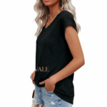 Woman wearing a VALE branded breathable cotton V-neck t-shirt in [Insert Color: Blue/Black/Orange], paired with denim jeans, showcasing a casual summer outfit.