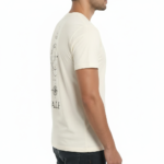 Back view of a man wearing a VALE brand 100% cotton breathable T-shirt featuring a black geometric compass and celestial line-art design.