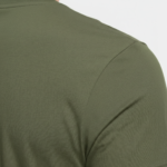 Close-up of a men's slim-fit pique cotton polo shirt in [Color Name] showing the premium fabric texture.