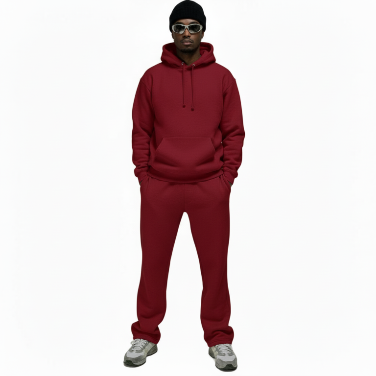Men's 2-piece breathable cotton performance tracksuit featuring a quarter-zip long-sleeve shirt and joggers with contrast side panels and gold VALE compass logo, available in Black, White, Blue, and Red.