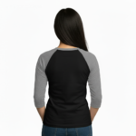 Young woman wearing a Vale Steampunk Clockwork graphic raglan shirt in 3/4 sleeves, made of breathable cotton, available in maroon, grey, and navy colorways.