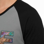 Men's VALE patchwork raglan shirt in white, grey, and cream with black and brown 3/4 sleeves, featuring decorative textured lettering.