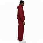 Men's 2-piece breathable cotton performance tracksuit featuring a quarter-zip long-sleeve shirt and joggers with contrast side panels and gold VALE compass logo, available in Black, White, Blue, and Red.