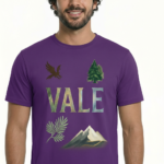 Man wearing a VALE nature graphic t-shirt featuring an eagle, pine tree, and mountain design in 100% breathable cotton.