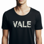 Close-up of a man wearing a burnt orange VALE distressed graphic t-shirt with white block lettering.