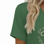 A woman wearing a breathable cotton V-neck T-shirt with a "Vale" butterfly graphic design, available in brown, green, and grey.