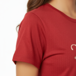 Person wearing a VALE graphic breathable cotton t-shirt in green, brown, and red colors with vintage floral design.