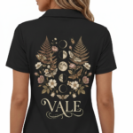 Back view of a premium cotton polo shirt featuring a VALE celestial graphic with moon phases, moths, and botanical ferns in vintage gold tones on black, navy, and maroon fabric.