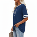 Women's oversized breathable cotton varsity t-shirt featuring a white VALE floral wreath graphic and striped sleeves, shown in Navy, Green, and Red.