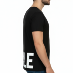 Close-up of a deep scoop neck shirt showing high-grade pique cotton texture.