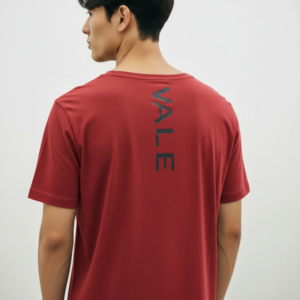 VALE Vertical Back Print Scoop T-Shirt Back view of a man wearing a Terracotta VALE slim-fit t-shirt with a vertical black logo on the spine