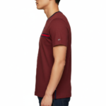 Close-up of a man wearing a VALE branded 100% cotton breathable slim-fit t-shirt with a horizontal chest stripe, available in grey, white, and maroon.