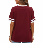Woman wearing VALE graphic print ringer t-shirt in maroon, grey, and beige colors with varsity sleeve stripes.
