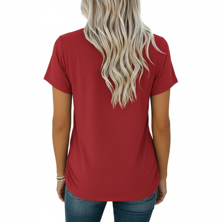 A woman wearing a slim-fit cotton graphic t-shirt featuring the word "VALE" inside a floral wreath design. Available in Dusty Blue, Olive Green, and Deep Maroon colors.