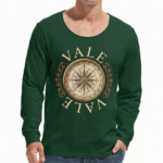"Man wearing a VALE brand long sleeve cotton shirt featuring a vintage gold nautical compass graphic on the chest, available in black, forest green, and burgundy."