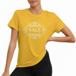 Women wearing VALE brand cotton graphic t-shirt with white filigree mandala design, available in blue, mustard, and cream.