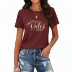 Women's 100% cotton breathable t-shirt with gold floral Vale graphic design, shown in Navy Blue, Maroon, and Green.