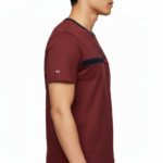 Close-up of a man wearing a VALE branded 100% cotton breathable slim-fit t-shirt with a horizontal chest stripe, available in grey, white, and maroon.