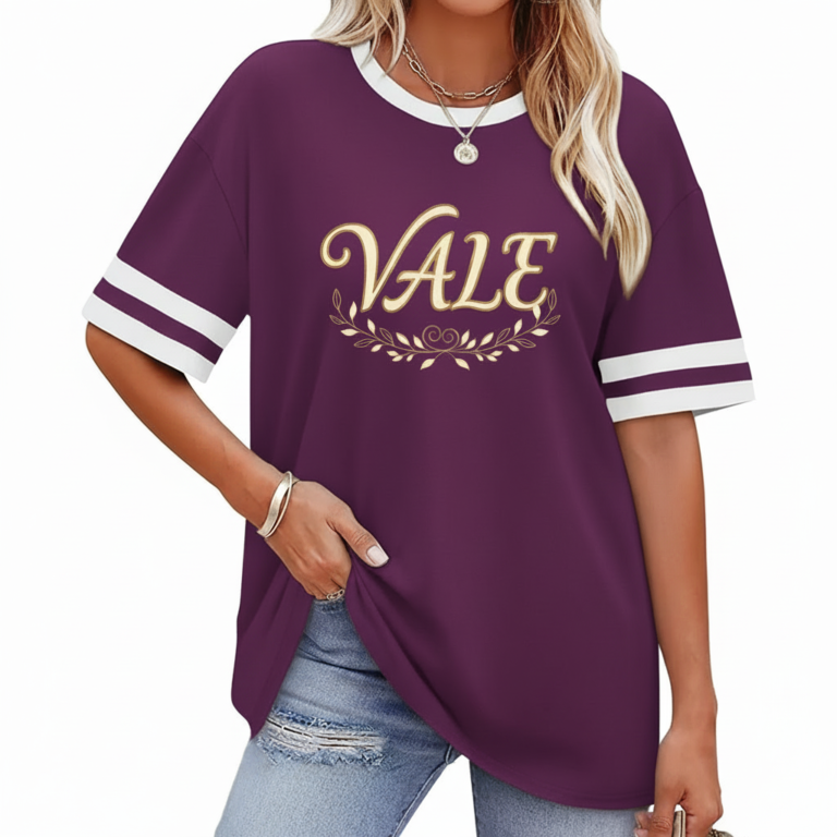 Woman wearing VALE graphic cotton t-shirt with striped sleeves and laurel wreath design in Blue, Plum, and Cream colors.
