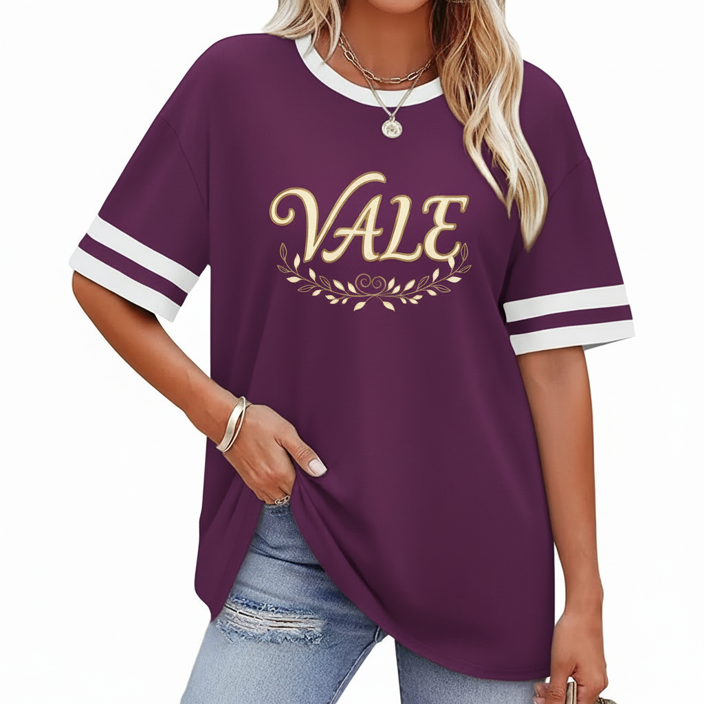 VALE Graphic Breathable Cotton T-Shirt Woman wearing VALE graphic cotton t-shirt with striped sleeves and laurel wreath design in Blue, Plum, and Cream colors.