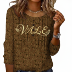 Women's breathable floral cotton blouse with VALE gold embroidery and pleated button-front design.