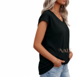 Woman wearing a VALE branded breathable cotton V-neck t-shirt in [Insert Color: Blue/Black/Orange], paired with denim jeans, showcasing a casual summer outfit.