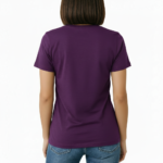 Female model wearing a Vale Limited Edition floral graphic t-shirt made of breathable cotton, featuring copper metallic flower design and script lettering.