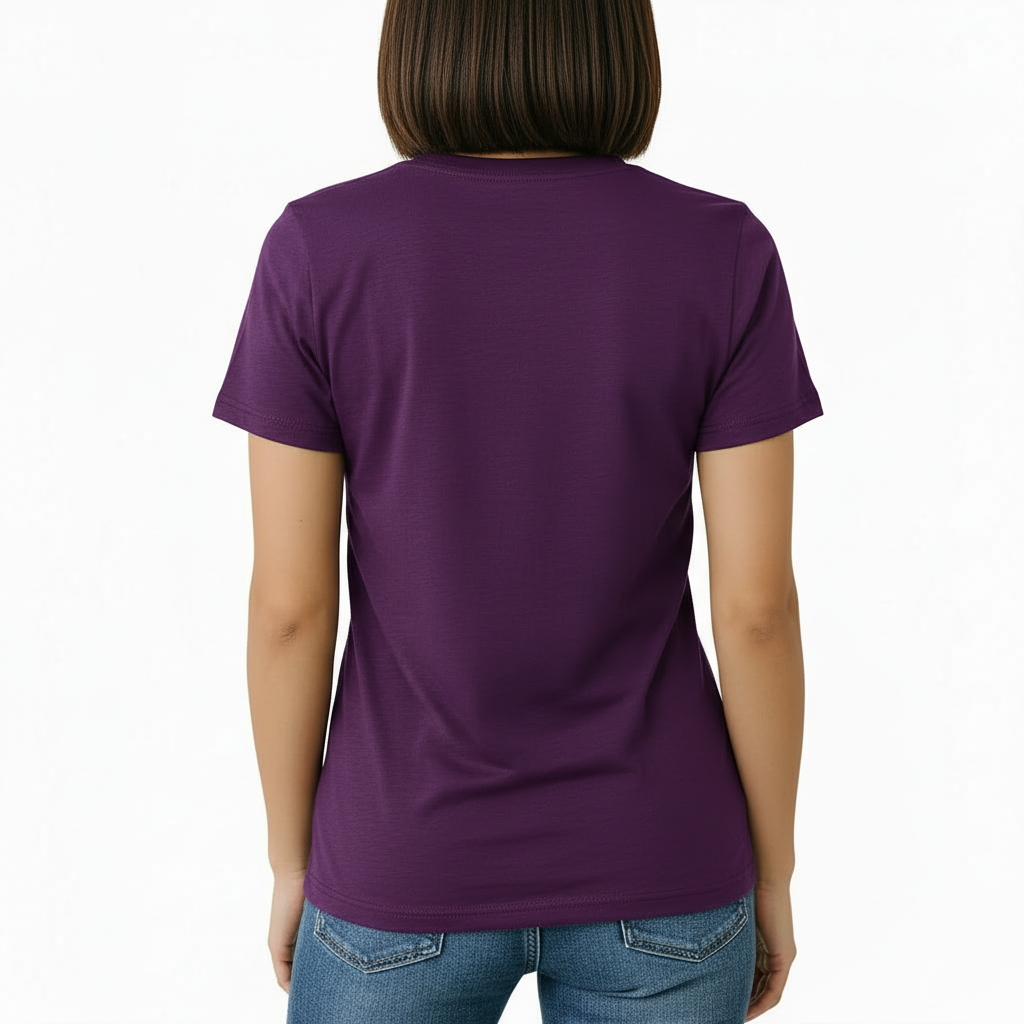 Female model wearing a Vale Limited Edition floral graphic t-shirt made of breathable cotton, featuring copper metallic flower design and script lettering.