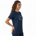 A female model showcasing the VALE branded floral graphic t-shirt in Navy Blue, Black, and White. 100% breathable cotton fabric featuring a silver script logo and elegant floral wreath design on a clean white background.