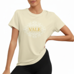 Women wearing VALE brand cotton graphic t-shirt with white filigree mandala design, available in blue, mustard, and cream.