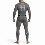 Back and front view of a man wearing a VALE brand compression suit featuring a manual transmission gear shifter graphic on the back of the long-sleeve shirt and matching leggings, shown in black, orange, and grey colors.