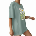 Women's oversized breathable cotton t-shirt featuring a vintage daisy floral print in sage green, brown, and red colors.