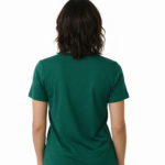 Woman wearing a Vale Authentic Style limited edition graphic t-shirt featuring rose gold butterfly and floral art on forest green, white, and burgundy cotton fabric.