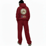 Men's 2-piece breathable cotton performance tracksuit featuring a quarter-zip long-sleeve shirt and joggers with contrast side panels and gold VALE compass logo, available in Black, White, Blue, and Red.