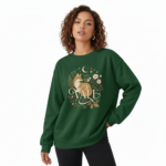 "Professional studio shot of a woman wearing a VALE brand cotton sweatshirt featuring a detailed fox and moon graphic design, available in Maroon, Forest Green, and Heather Gray."